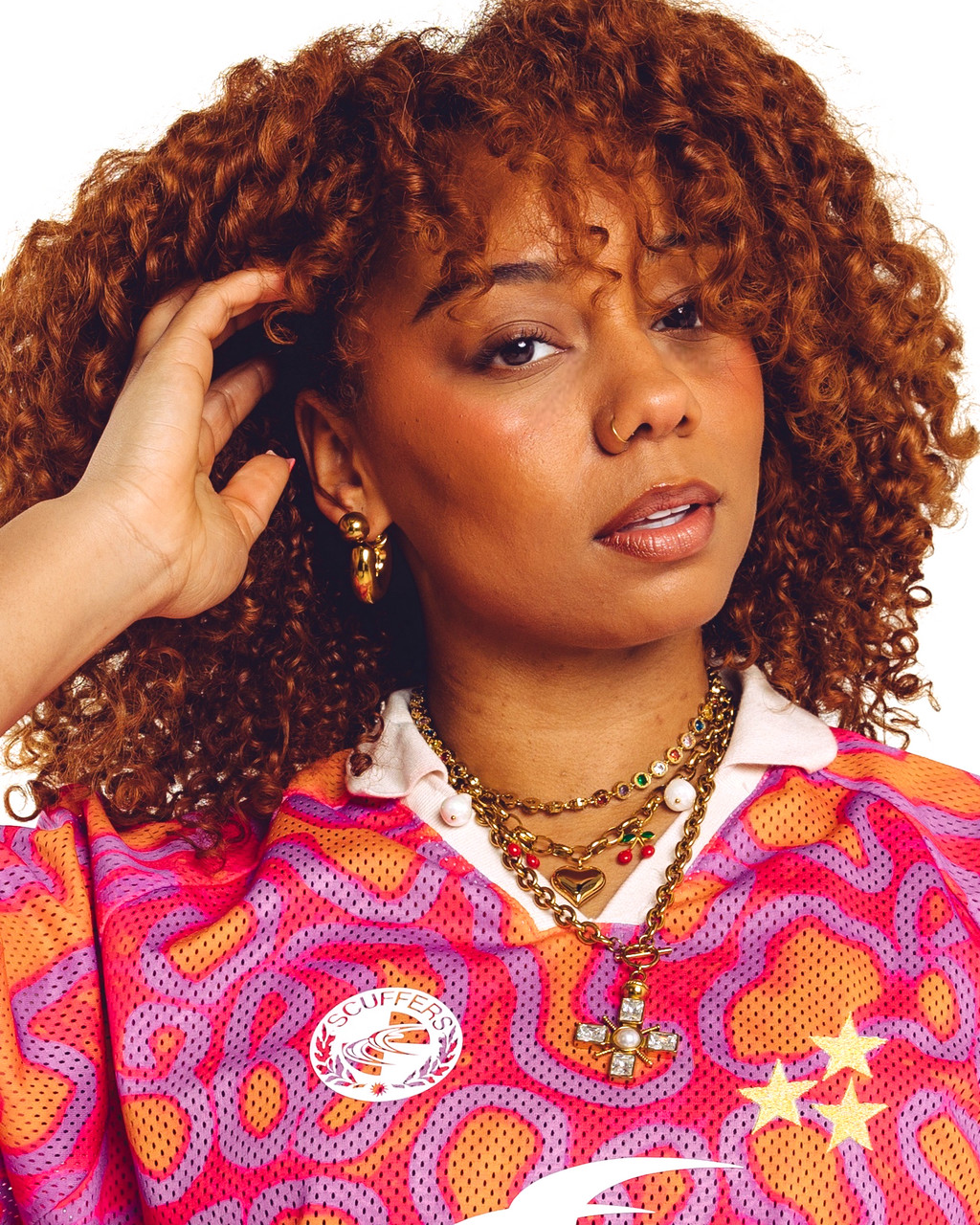 Arc gold hoop earrings close up on model — chunky bold statement earrings by STXCKD