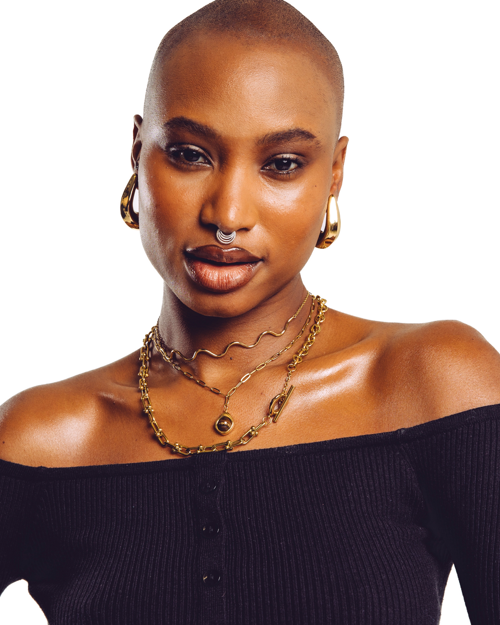 Lune gold hoop earrings close up on model — smooth everyday statement earrings by STXCKD