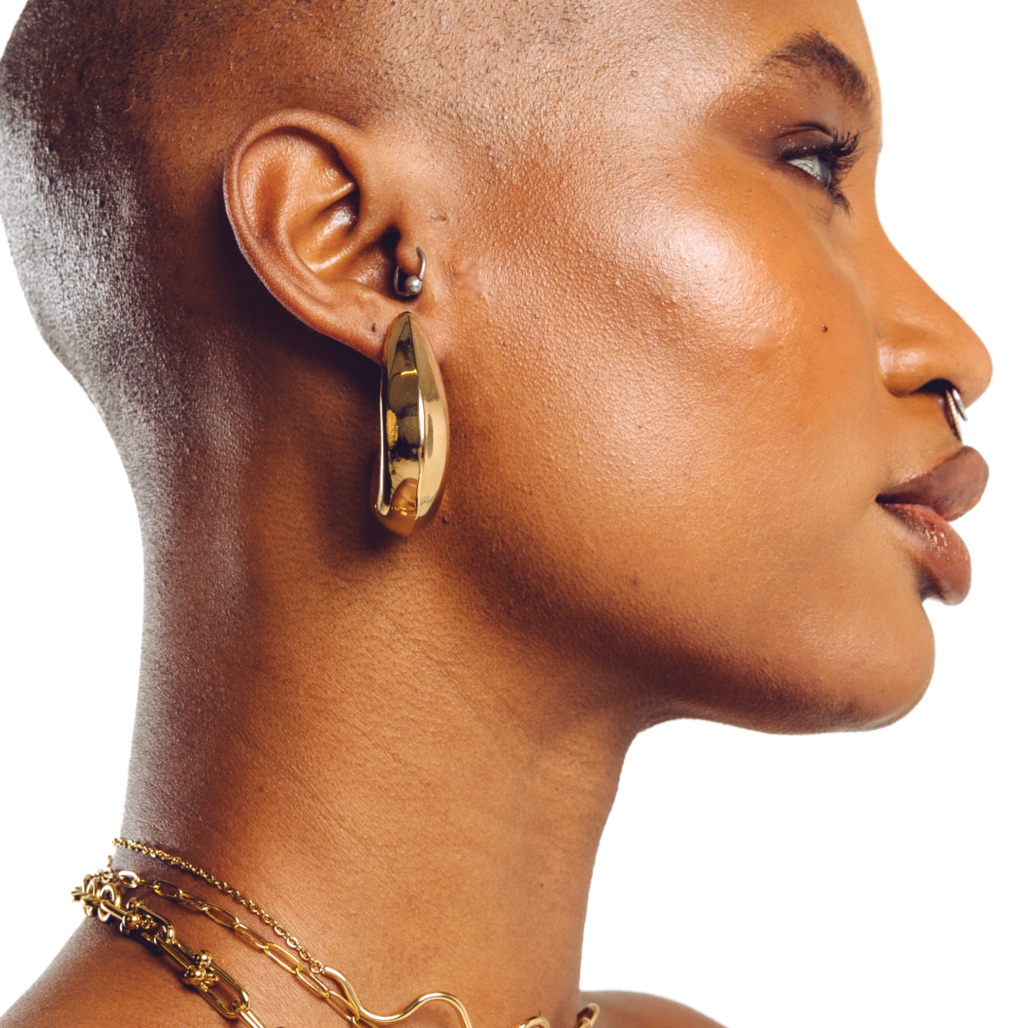 Lune everyday gold hoop earrings worn by model — smooth statement earrings by STXCKD