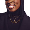 Muse gold necklace stack — three layered gold necklaces worn by model | STXCKD