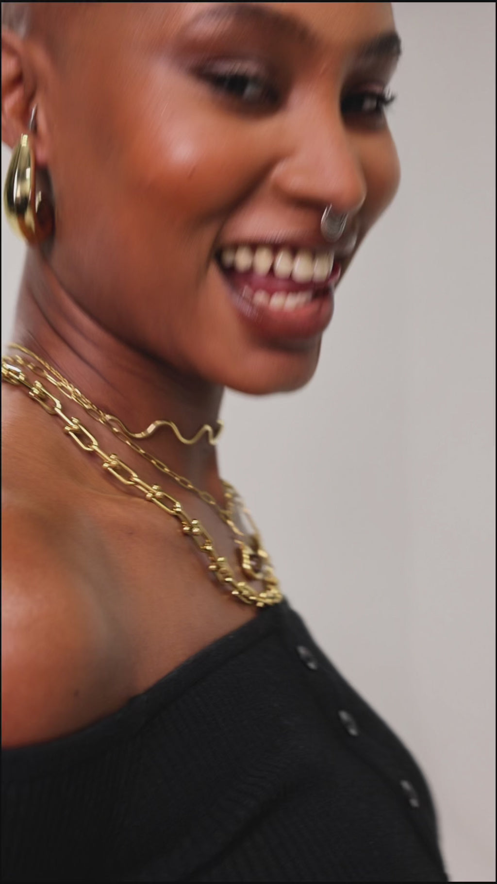 Model wearing Lune smooth gold hoop earrings — everyday statement jewellery by STXCKD