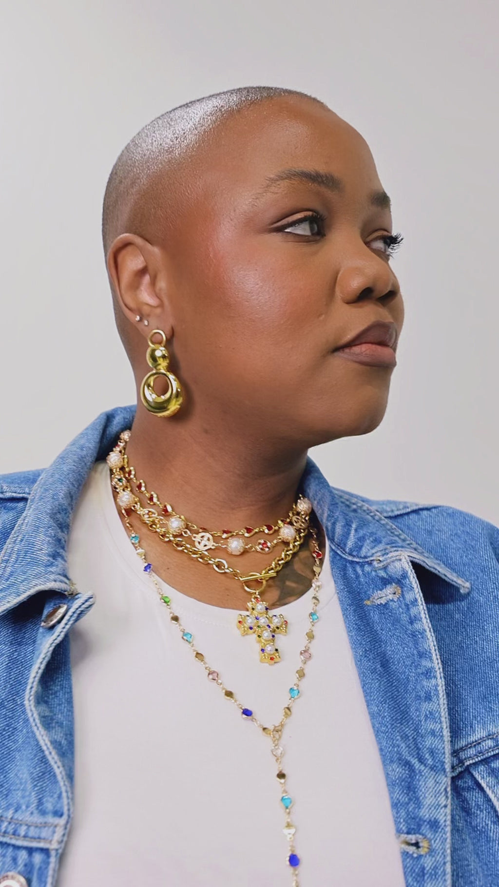 Model wearing Orbit bold gold drop earrings — statement jewellery by STXCKD